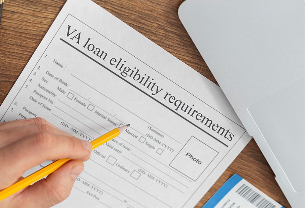 A laptop, and signing of VA loan eligibility requirements form